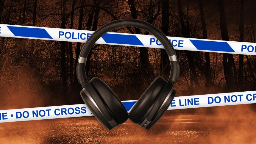 Headphones and police crime scene tape with a spooky forest background