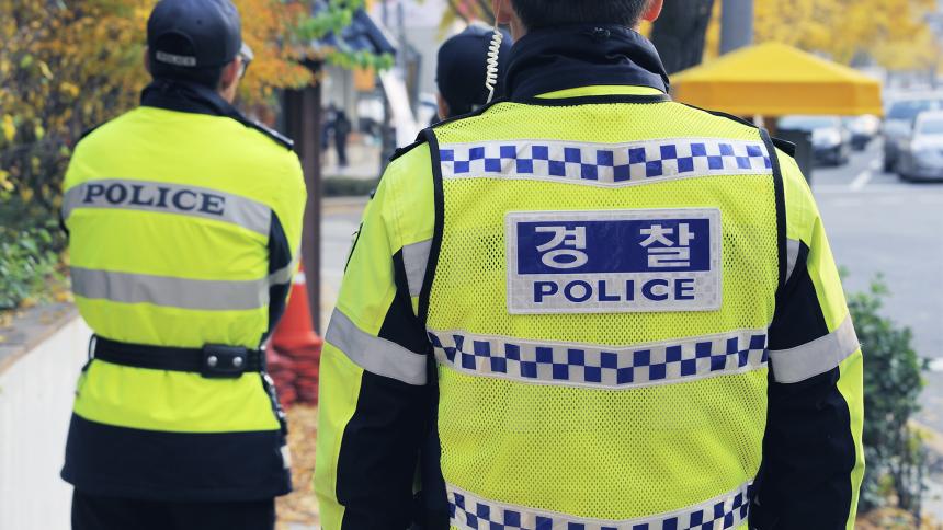 Three South Korean policemen on patrol