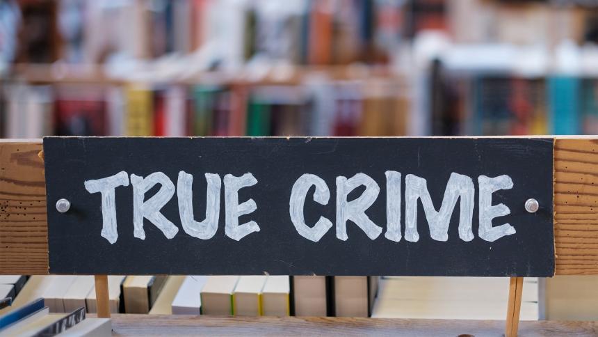 A 'true crime' sign in a library
