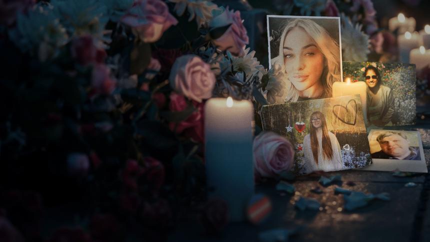 Flowers and candles are laid at a tribute to innocent people who have died