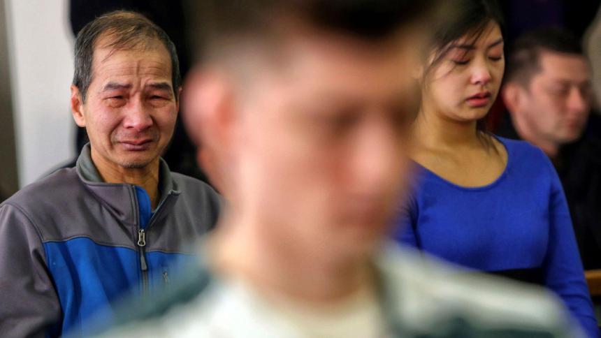Hung Bui and Anny Bui, the father and sister of Anna Bui, become emotional at the sentencing hearing of Allen Ivanov. Allen Ivanov stands in the foreground