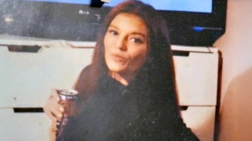 Sarah Henshaw posing in a personal photo with a can in her hand