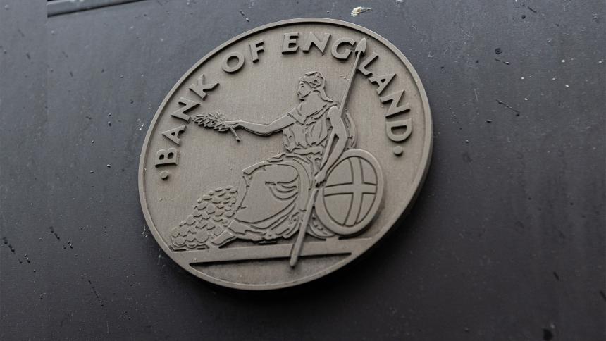 Bank of England crest on the side of a building