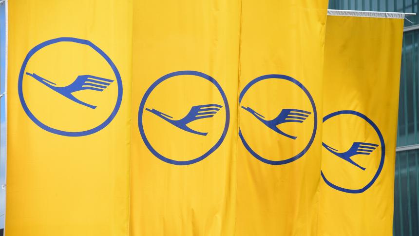 The Lufthansa logo on a series of yellow flags