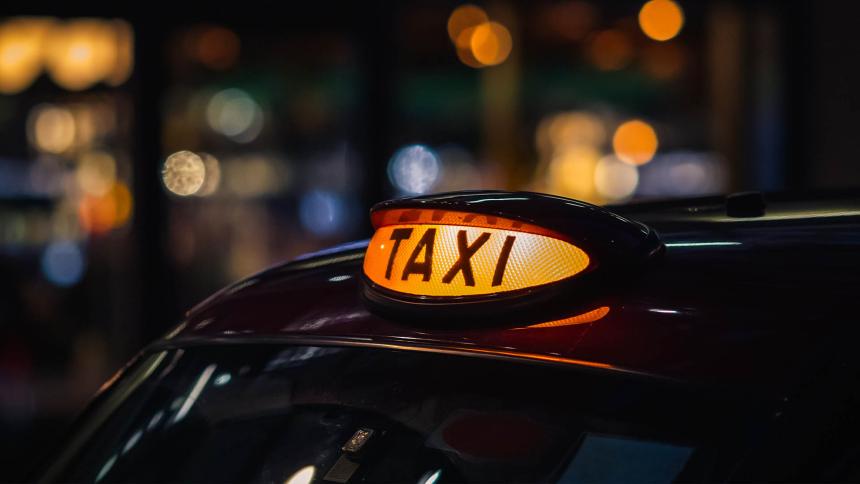 The light on top of a London taxi at night
