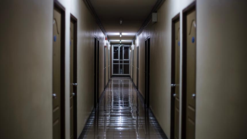 A dark dormitory corridor