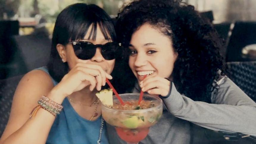 Desiree Gibbon sharing a large cocktail with her mother