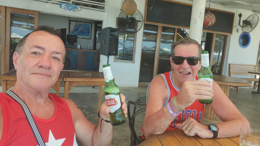 Paul Longworth and Albert Alfonso drinking beers together on holiday