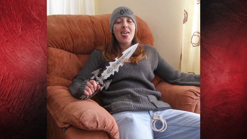 Joanna Dennehy sitting in a chair holding a very large knife